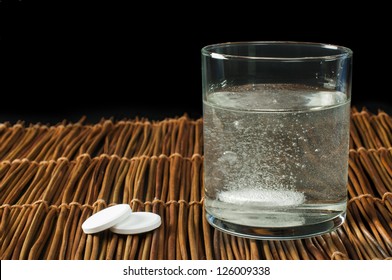 Water Soluble Aspirin. Glass Of Water And Pills.