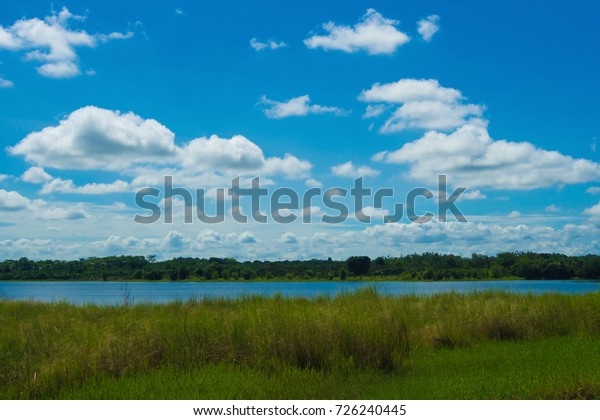 Water\
sources and green meadows are covered with\
clouds.