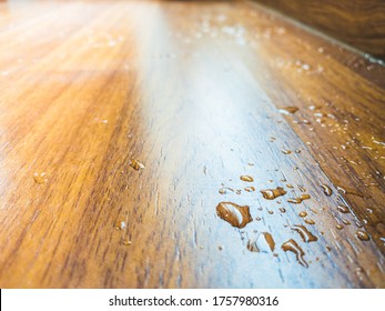 Water Spill On Parquet Wood Floor, Which Leaking From Air Conditioner In The House.