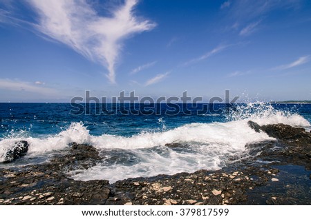 water splash and blue ocean and rocky shore