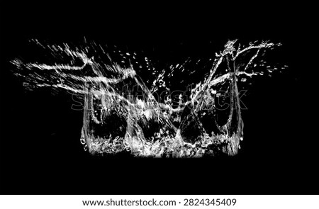 Water Splash Explosion: An dynamic and energetic splash of clear water erupts against a stark black background, capturing the raw power and beauty of liquid in motion.
