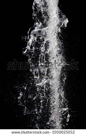 Water splash over black background