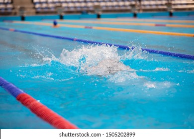 Water Splash In Swimming Pool. Empty Swimming Pool With Clear Blue Water. 