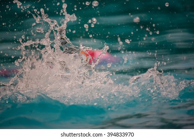 Water Splash From Young Man Swim In The Pool For Swimming Competition