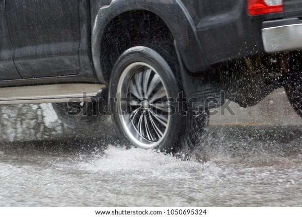 Water\
Splashed by a car running through a flooded road after heavy rain,\
blurry movement                              \
