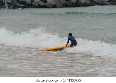 Water Splashes Around Young Surfer Going To Epic Barrel Wave. Extreme Pro Sportsman Surfing A Wave In Basque Autonomous Community In Summer Cloudy Day