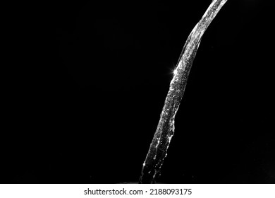 water splashes isolated on black background. white jets with drops. High quality photo