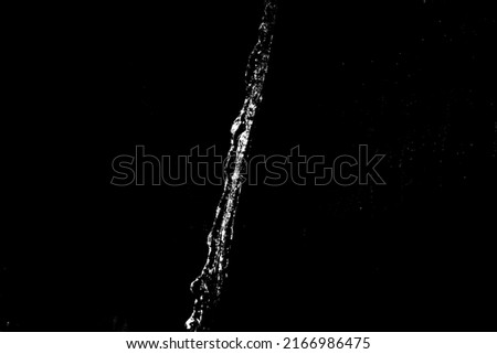 water splashes isolated on black background. white jets with drops. High quality photo