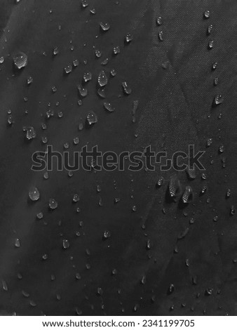 Water splashes on a waterproof surface create the effect of water droplets.