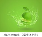 Water splashing on Fresh green lime isolated on green background