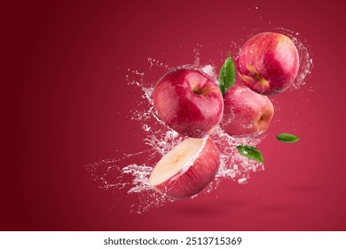 Water splashing on Fresh Red apple on a red background - Powered by Shutterstock