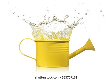 water splashing out from a yellow watering can