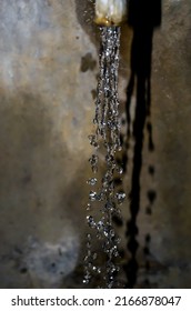 Water splashing from the tap like diamonds. Water droplets and dripping water from the water faucet.