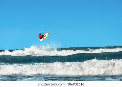 Water Sports. Kiteboarding, Kitesurfing. Surfer Man Surfing On Waves In Ocean, Sea. Extreme Sport Action. Recreational Sporting Activity. Healthy Active Lifestyle. Summer Fun Adventure. Hobby