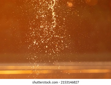 Water Spray At Sunset In Summer. Abstract Background