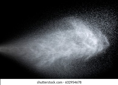 Water is sprayed on a black background.