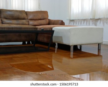 Water Spreading / Flooding On Living Room Parquet Floor In A House - Damage Caused By Water Leakage