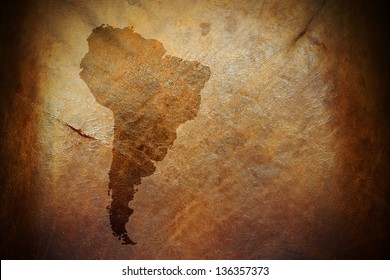 Water Stain Mark In The Shape Of The South America Continent Map On A Vintage Brown Leather Parchment.