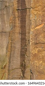 Water Stains On Sunlit Millstone Grit Rock Face