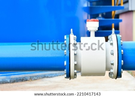 Water steel pipe and water meter close up image. Select focus of drink water piping. Flange Pipe Fitting