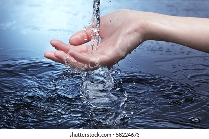 Water Stream On Woman Hand