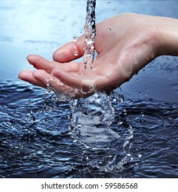 Water Stream On Woman Hand