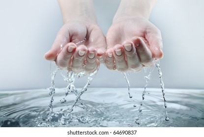 water stream on woman hand