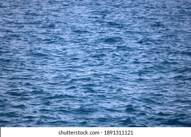 Water Surface Of Deep Blue Sea. Soft Waves Texture, Ripple Water For Background