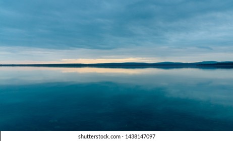 The Water Surface Of The Northern Lake At Night