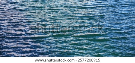 Water surface. The texture of the water. Waves on the lake windy weather.