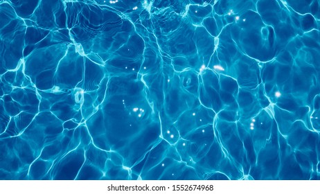 water in swimming pool rippled water detail background.Background shot of aqua sea water surface