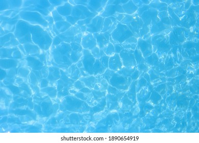 water in swimming pool rippled water detail background 