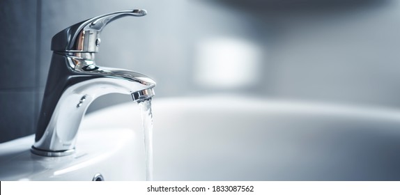 Water tap , faucet. Flow water in bathroom with sink. Modern clean hause. Backround hygiene. Panorama - Shutterstock ID 1833087562