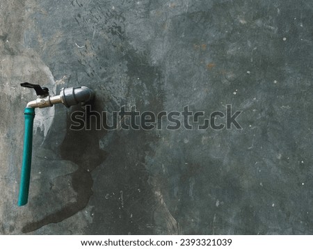 water tap on cement background