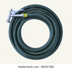 Water Taps And Green Garden Hose With A Sprayer On A White Background