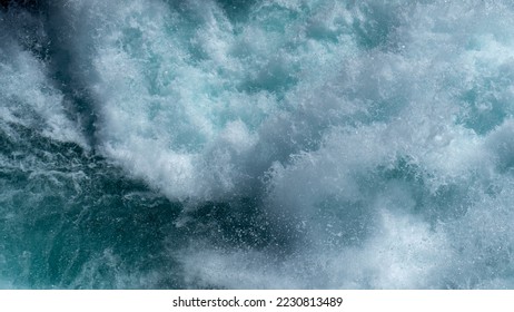 Water texture. Huka Falls, Taupo, New Zealand.

Huka Falls is a set of waterfalls along the Waikato River, which drain Lake Taupō. Water rushes through the falls creating a series of violent rapids. - Shutterstock ID 2230813489