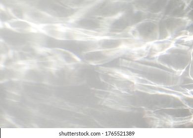 Water texture overlay effect for photo and mockups. Organic drop diagonal shadow and light caustic effect on a white wall. Shadows for natural light effects - Shutterstock ID 1765521389