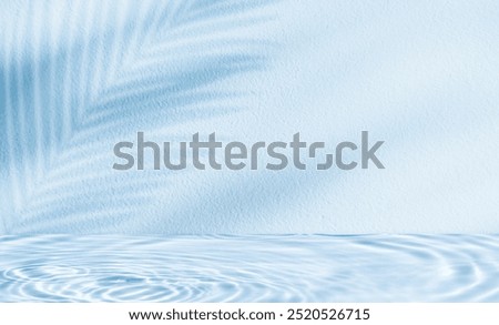 Water texture surface on blue wall background,Backdrop Summer nature light,palm leaves shadow on pool water ripple pattern for cosmetic product podium,Blue background for beautym,spa banner 
