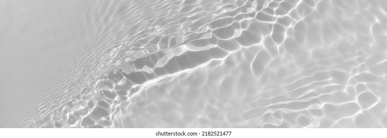 Water texture with wave sun reflections on the water overlay effect for photo or mockup. Organic light gray drop shadow caustic effect with wave refraction of light. Long Banner with copy space. - Shutterstock ID 2182521477