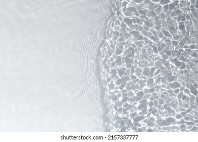 Water texture with waves on the water overlay effect for photo or mockup. Organic light gray drop shadow caustic effect with wave refraction of light. Banner with empty space.