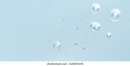 Water Toner Serum Texture With Bubbles. Blue Skincare Background. Cosmetic Liquid Product Macro