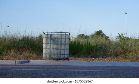 Water Tote Plastic Drum In An Open Field