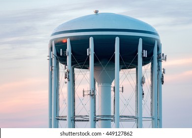 A Water tower in the deep blue sky background