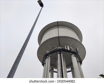 A Water Tower Is An Elevated Building Supporting A Water Tank Constructed At A Height Sufficient To Pressurize A Water Distribution System For The Distribution Of Potable Water.