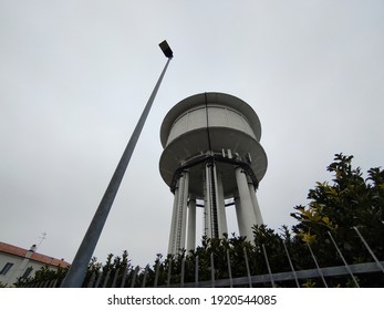 A Water Tower Is An Elevated Building Supporting A Water Tank Constructed At A Height Sufficient To Pressurize A Water Distribution System For The Distribution Of Potable Water.