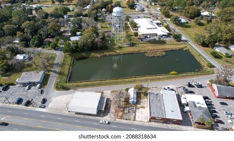 Water tower and retention pond Aerial drone photography over city of Starke North Florida December 7 2021 United States