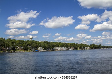 A Water Tower As Seen From The Conesus Finger Lake In Upstate New York, USA