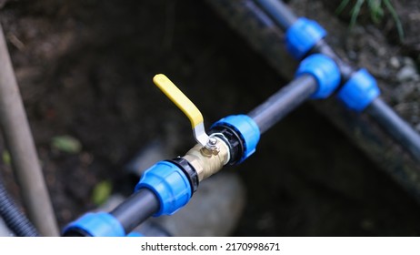 Water valve connected to PVC pipe closeup