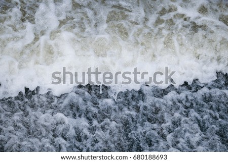 Similar – Luftaufnahme Panoramadrohne Blick auf den blauen Ozean Wellen, die am Sandstrand in Portugal erdrücken.