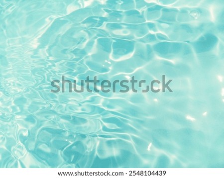 Water waves with shining pattern texture background water.Blue water with ripples on the surface. Defocus blurred water​ transparent blue colored clear calm water surface texture with splashes water​.